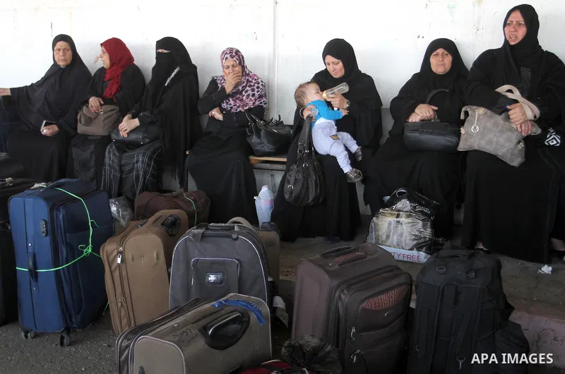 Palestinians wait permission to enter Egypt as they gather at the Rafah border crossing in the southern Gaza Strip on on November 14, 2016. Egypt is due to reopen its Rafah border crossing with Gaza for Five days. Photo...