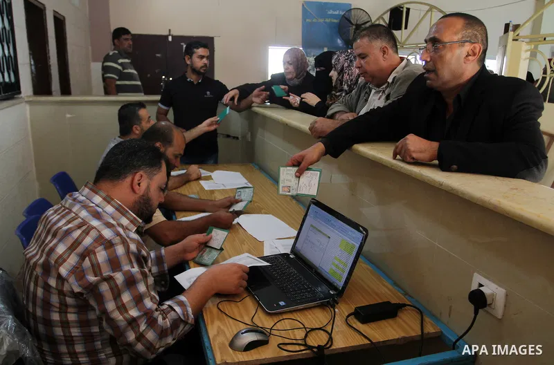 Palestinians wait permission to enter Egypt as they gather at the Rafah border crossing in the southern Gaza Strip on on November 14, 2016. Egypt is due to reopen its Rafah border crossing with Gaza for Five days. Photo...