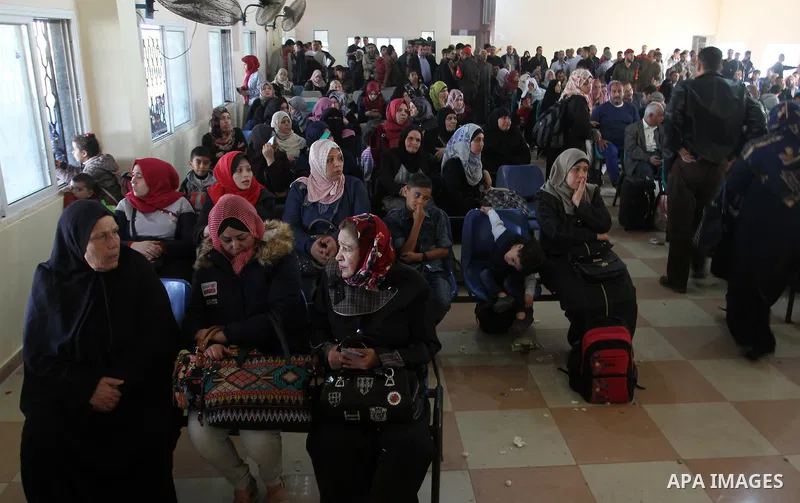 Palestinians wait permission to enter Egypt as they gather at the Rafah border crossing in the southern Gaza Strip on on November 14, 2016. Egypt is due to reopen its Rafah border crossing with Gaza for Five days. Photo...