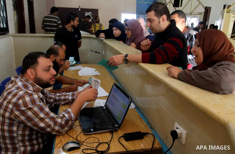 Palestinians wait permission to enter Egypt as they gather at the Rafah border crossing in the southern Gaza Strip on on November 14, 2016. Egypt is due to reopen its Rafah border crossing with Gaza for Five days. Photo...