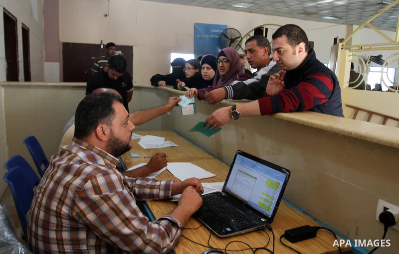 Palestinians wait permission to enter Egypt as they gather at the Rafah border crossing in the southern Gaza Strip on on November 14, 2016. Egypt is due to reopen its Rafah border crossing with Gaza for Five days. Photo...