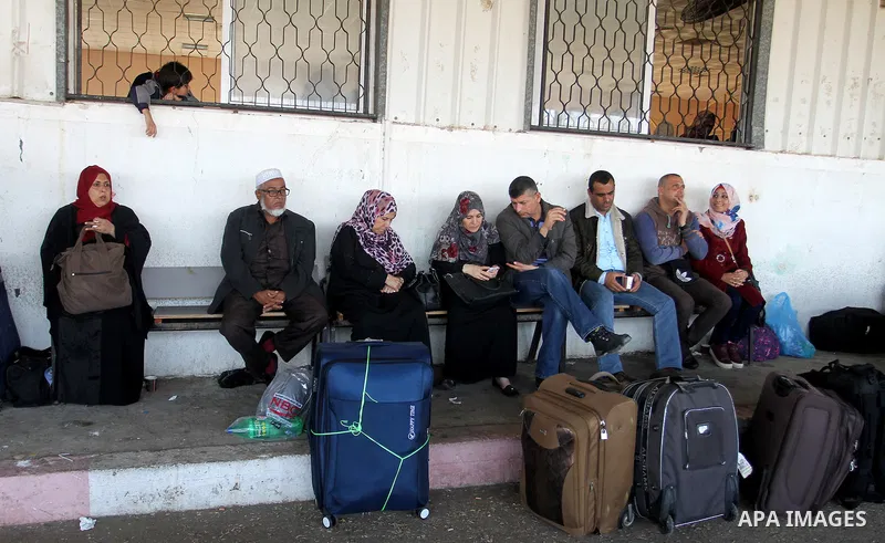 Palestinians wait permission to enter Egypt as they gather at the Rafah border crossing in the southern Gaza Strip on on November 14, 2016. Egypt is due to reopen its Rafah border crossing with Gaza for Five days. Photo...