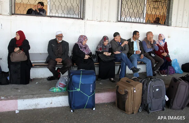 Palestinians wait permission to enter Egypt as they gather at the Rafah border crossing in the southern Gaza Strip on on November 14, 2016. Egypt is due to reopen its Rafah border crossing with Gaza for Five days. Photo...