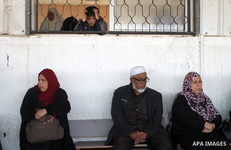 Palestinians wait permission to enter Egypt as they gather at the Rafah border crossing in the southern Gaza Strip on on November 14, 2016. Egypt is due to reopen its Rafah border crossing with Gaza for Five days. Photo...