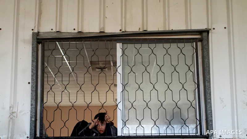Palestinians wait permission to enter Egypt as they gather at the Rafah border crossing in the southern Gaza Strip on on November 14, 2016. Egypt is due to reopen its Rafah border crossing with Gaza for Five days. Photo...