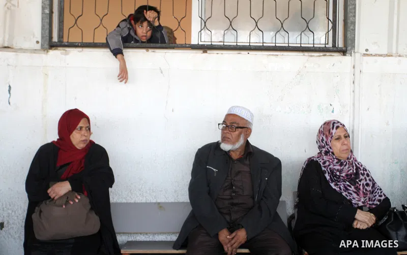 Palestinians wait permission to enter Egypt as they gather at the Rafah border crossing in the southern Gaza Strip on on November 14, 2016. Egypt is due to reopen its Rafah border crossing with Gaza for Five days. Photo...