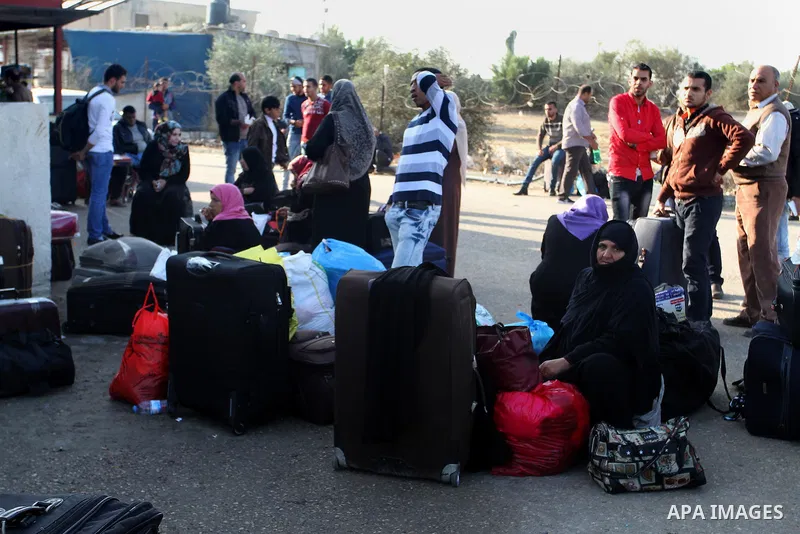 Palestinians wait permission to enter Egypt as they gather at the Rafah border crossing in the southern Gaza Strip on on November 14, 2016. Egypt is due to reopen its Rafah border crossing with Gaza for Five days. Photo...