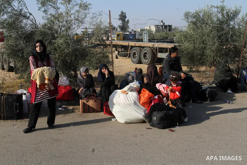Palestinians wait permission to enter Egypt as they gather at the Rafah border crossing in the southern Gaza Strip on on November 14, 2016. Egypt is due to reopen its Rafah border crossing with Gaza for Five days. Photo...