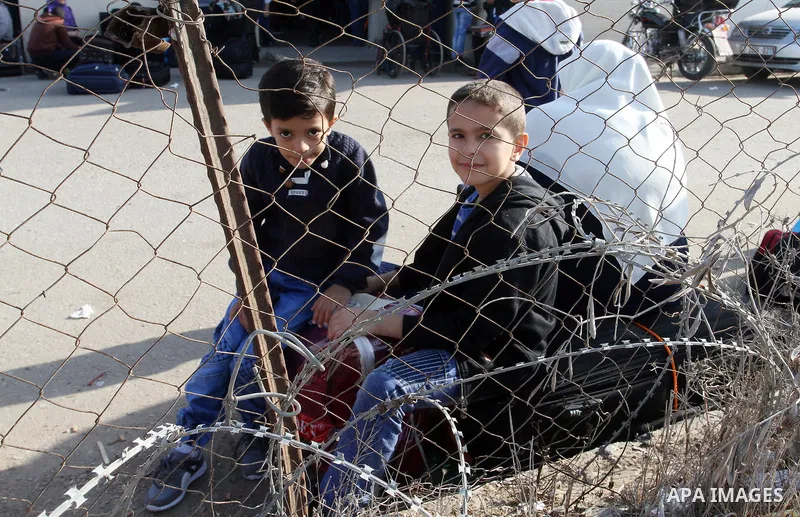 Palestinians wait permission to enter Egypt as they gather at the Rafah border crossing in the southern Gaza Strip on on November 14, 2016. Egypt is due to reopen its Rafah border crossing with Gaza for Five days. Photo...
