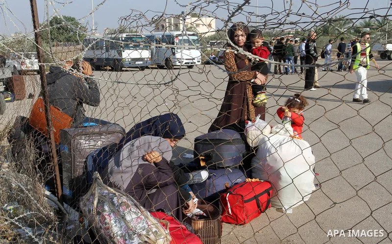 Palestinians wait permission to enter Egypt as they gather at the Rafah border crossing in the southern Gaza Strip on on November 14, 2016. Egypt is due to reopen its Rafah border crossing with Gaza for Five days. Photo...
