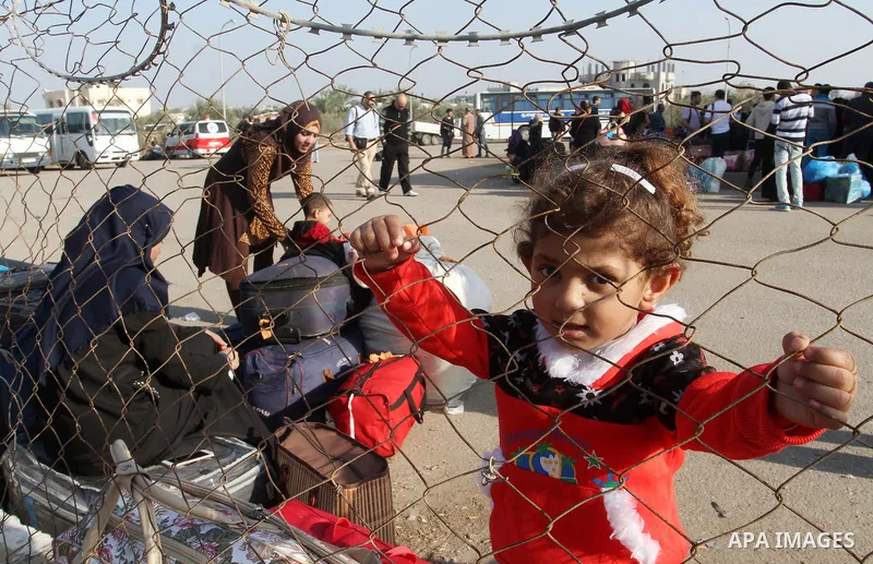 Palestinians wait permission to enter Egypt as they gather at the Rafah border crossing in the southern Gaza Strip on on November 14, 2016. Egypt is due to reopen its Rafah border crossing with Gaza for Five days. Photo...