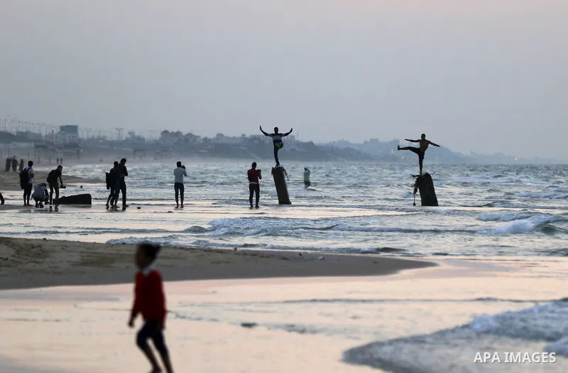 Palestinians enjoy their time off the beach of Gaza City on November 14, 2016. Photo by Yasser Qudih
