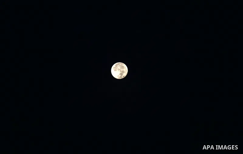 A supermoon is pictured above at dawn in Gaza city, on November 15, 2016. Photo by Mohammed Asad