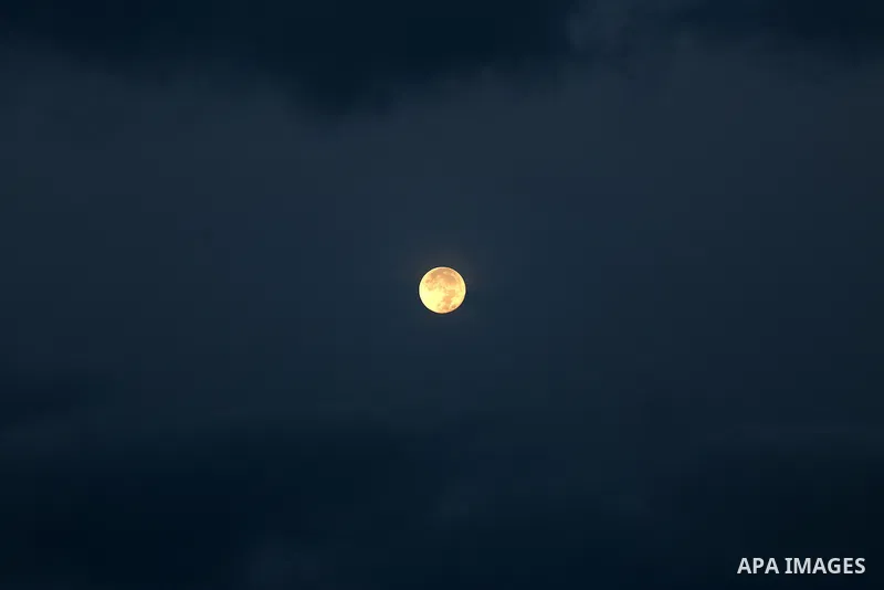 A supermoon is pictured above at dawn in Gaza city, on November 15, 2016. Photo by Mohammed Asad
