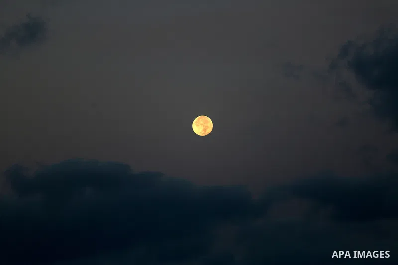 A supermoon is pictured above at dawn in Gaza city, on November 15, 2016. Photo by Mohammed Asad
