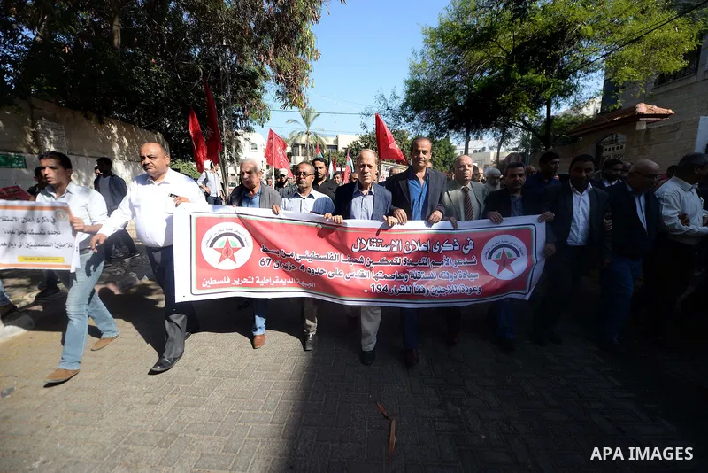 Palestinian supporters of the Popular Front for the Liberation of Palestine (PFLP) take part in a protest marking the national day of independence, in Gaza City on November 15, 2016. Photo by Hassan Jedi