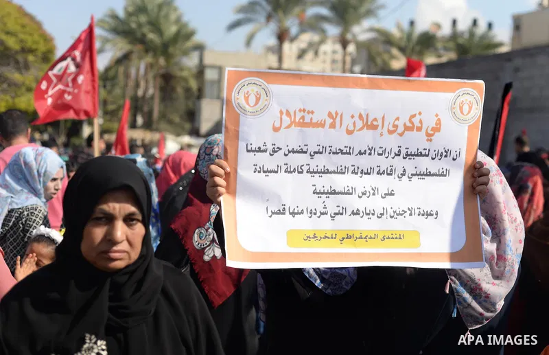 Palestinian supporters of the Popular Front for the Liberation of Palestine (PFLP) take part in a protest marking the national day of independence, in Gaza City on November 15, 2016. Photo by Hassan Jedi