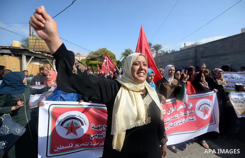 Palestinian supporters of the Popular Front for the Liberation of Palestine (PFLP) take part in a protest marking the national day of independence, in Gaza City on November 15, 2016. Photo by Hassan Jedi