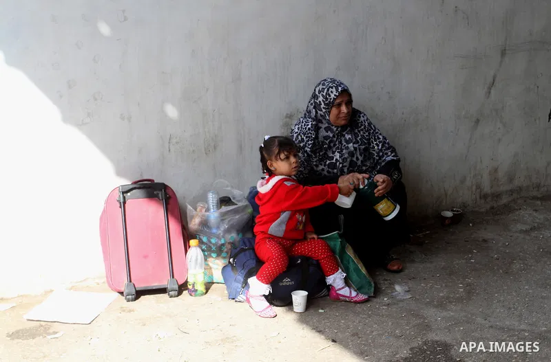 Palestinians wait permission to enter Egypt as they gather at the Rafah border crossing in the southern Gaza Strip on on November 15, 2016. Egypt is due to reopen its Rafah border crossing with Gaza for Five days. Photo...