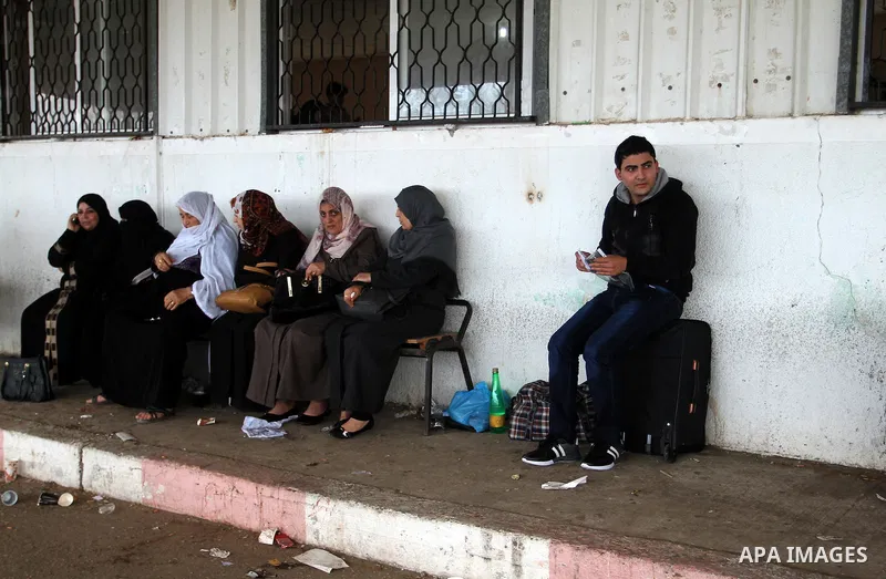 Palestinians wait permission to enter Egypt as they gather at the Rafah border crossing in the southern Gaza Strip on on November 15, 2016. Egypt is due to reopen its Rafah border crossing with Gaza for Five days. Photo...