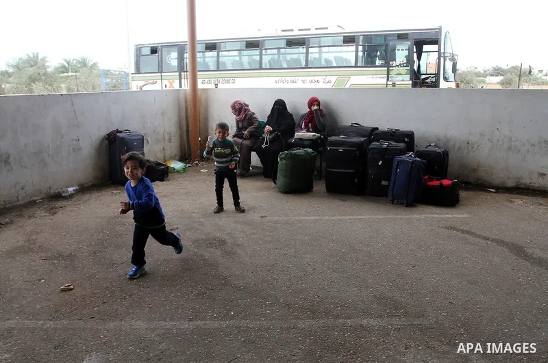 Palestinians wait permission to enter Egypt as they gather at the Rafah border crossing in the southern Gaza Strip on on November 15, 2016. Egypt is due to reopen its Rafah border crossing with Gaza for Five days. Photo...