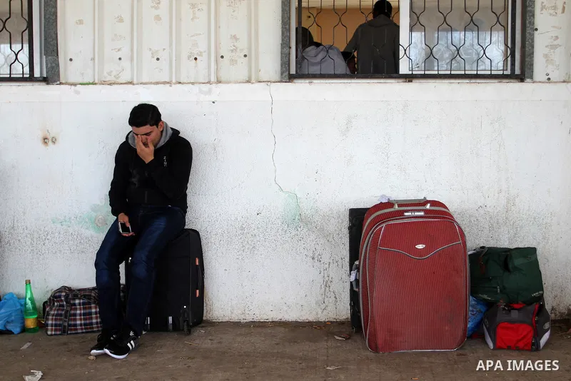 Palestinians wait permission to enter Egypt as they gather at the Rafah border crossing in the southern Gaza Strip on on November 15, 2016. Egypt is due to reopen its Rafah border crossing with Gaza for Five days. Photo...