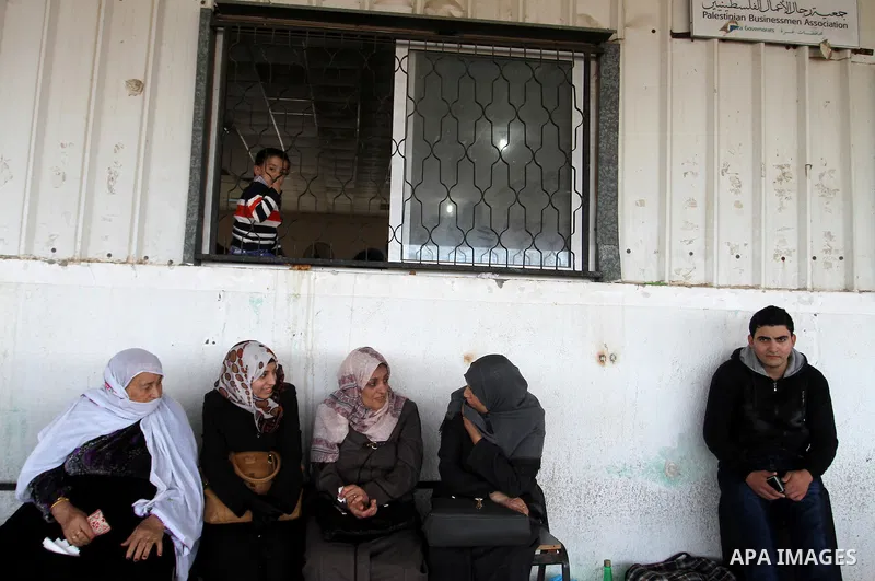 Palestinians wait permission to enter Egypt as they gather at the Rafah border crossing in the southern Gaza Strip on on November 15, 2016. Egypt is due to reopen its Rafah border crossing with Gaza for Five days. Photo...