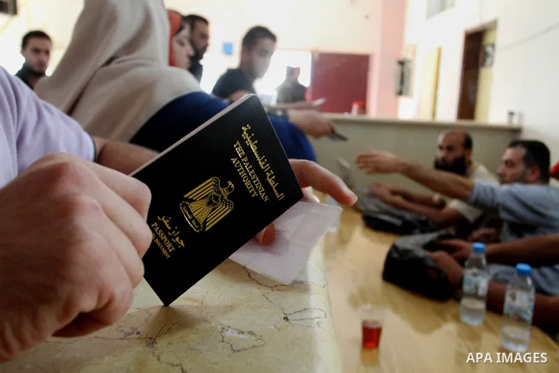 Palestinians wait permission to enter Egypt as they gather at the Rafah border crossing in the southern Gaza Strip on on November 15, 2016. Egypt is due to reopen its Rafah border crossing with Gaza for Five days. Photo...
