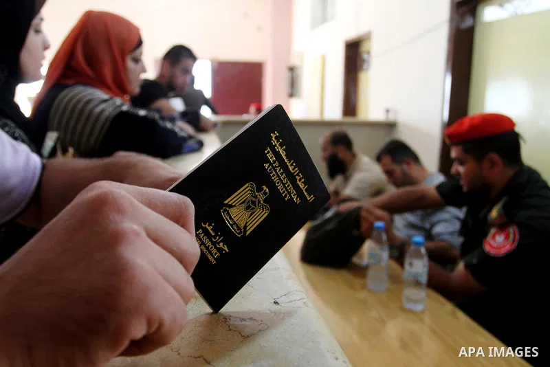 Palestinians wait permission to enter Egypt as they gather at the Rafah border crossing in the southern Gaza Strip on on November 15, 2016. Egypt is due to reopen its Rafah border crossing with Gaza for Five days. Photo...