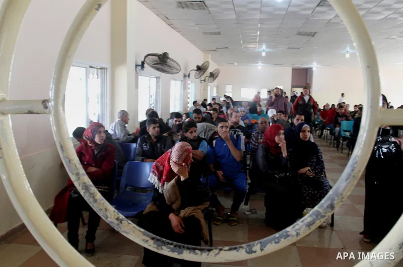 Palestinians wait permission to enter Egypt as they gather at the Rafah border crossing in the southern Gaza Strip on on November 15, 2016. Egypt is due to reopen its Rafah border crossing with Gaza for Five days. Photo...