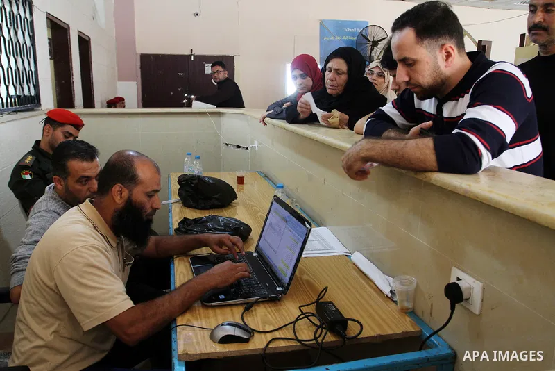 Palestinians wait permission to enter Egypt as they gather at the Rafah border crossing in the southern Gaza Strip on on November 15, 2016. Egypt is due to reopen its Rafah border crossing with Gaza for Five days. Photo...