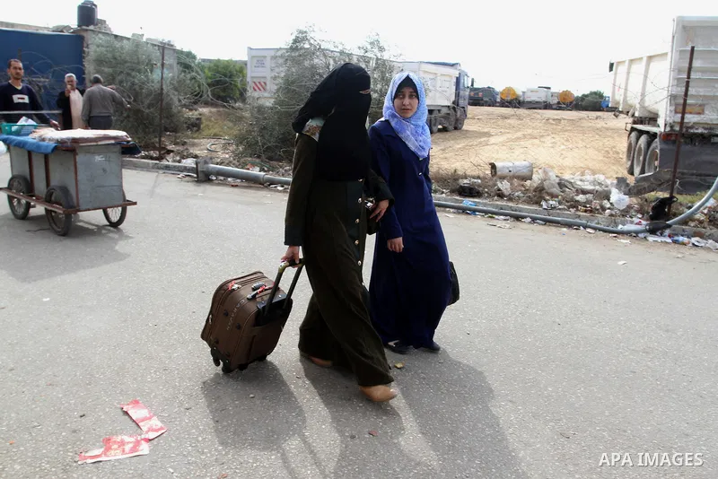 Palestinians wait permission to enter Egypt as they gather at the Rafah border crossing in the southern Gaza Strip on on November 15, 2016. Egypt is due to reopen its Rafah border crossing with Gaza for Five days. Photo...