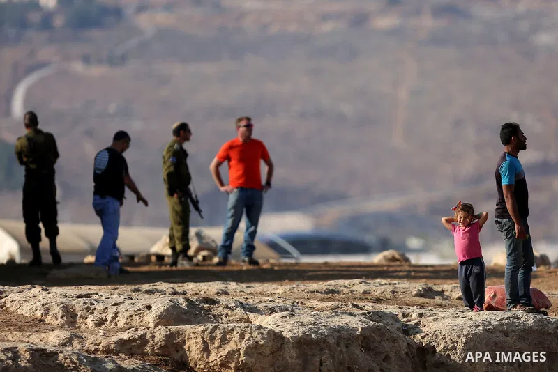 Israeli security forces confiscate barracks in the Palestinian Bedouin residential area after Israeli authorities said it was built without a permit in the West Bank village of Jab'a, north east of Jerusalem on Nov. 15,...