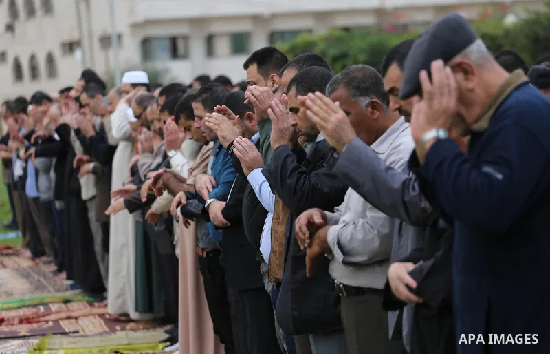Palestinians pray for rain at al-Kateba square in Gaza City on November 16, 2016. The Ministry of Awqaf and Religious Affairs have held special prayers to invoke God for rain. The special Muslim prayers known as Salat al...