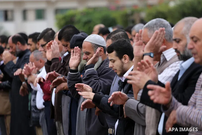 Palestinians pray for rain at al-Kateba square in Gaza City on November 16, 2016. The Ministry of Awqaf and Religious Affairs have held special prayers to invoke God for rain. The special Muslim prayers known as Salat al...