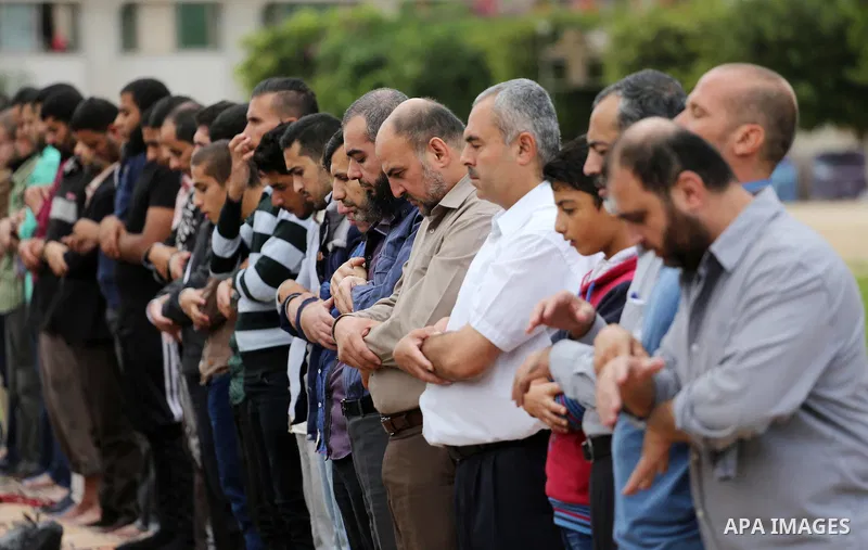 Palestinians pray for rain at al-Kateba square in Gaza City on November 16, 2016. The Ministry of Awqaf and Religious Affairs have held special prayers to invoke God for rain. The special Muslim prayers known as Salat al...