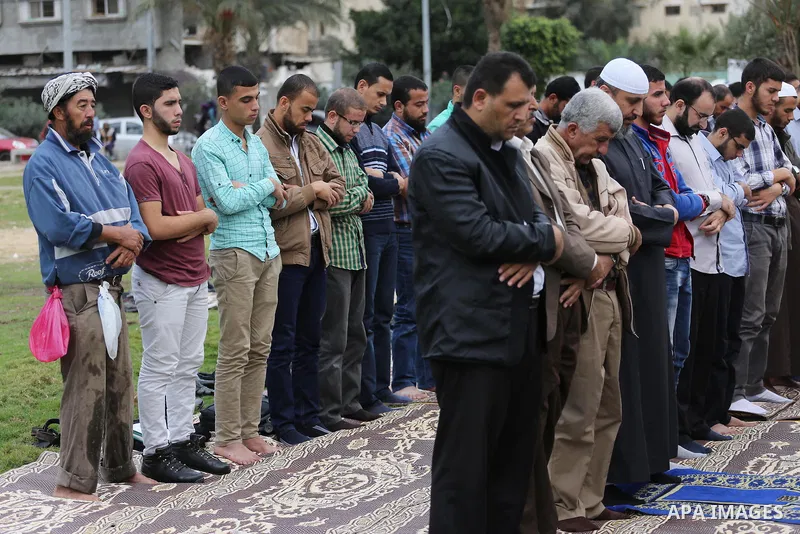Palestinians pray for rain at al-Kateba square in Gaza City on November 16, 2016. The Ministry of Awqaf and Religious Affairs have held special prayers to invoke God for rain. The special Muslim prayers known as Salat al...