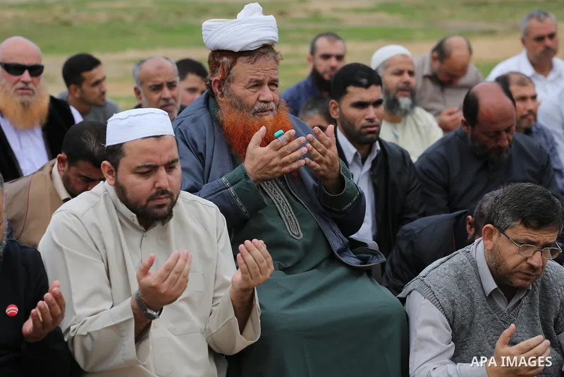 Palestinians pray for rain at al-Kateba square in Gaza City on November 16, 2016. The Ministry of Awqaf and Religious Affairs have held special prayers to invoke God for rain. The special Muslim prayers known as Salat al...