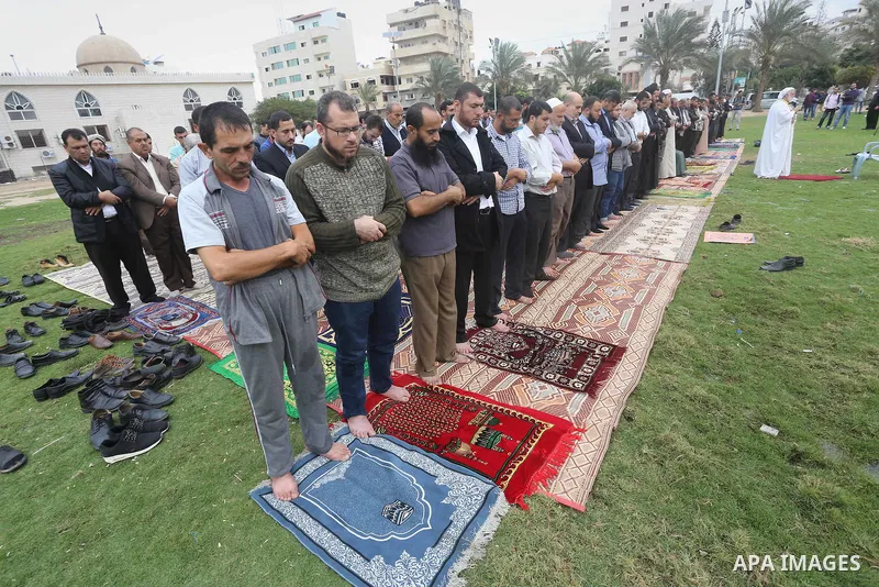 Palestinians pray for rain at al-Kateba square in Gaza City on November 16, 2016. The Ministry of Awqaf and Religious Affairs have held special prayers to invoke God for rain. The special Muslim prayers known as Salat al...