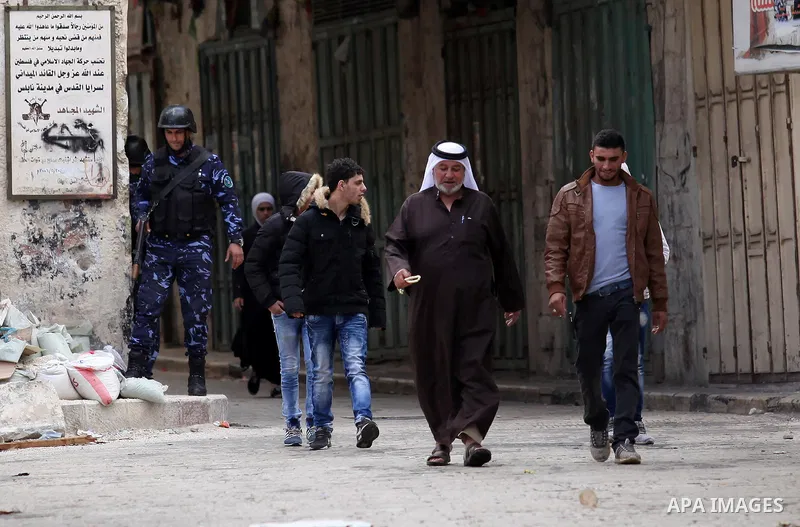 Members of the Palestinian security forces patrol in the West Bank city of Nablus on November 16, 2016. A Palestinian woman was killed and three Palestinian security officers were injured during armed clashes with suspec...