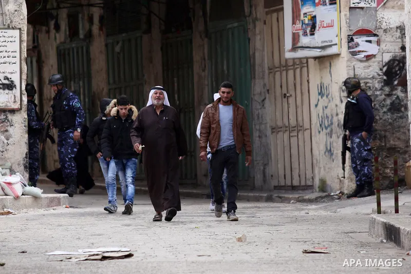 Members of the Palestinian security forces patrol in the West Bank city of Nablus on November 16, 2016. A Palestinian woman was killed and three Palestinian security officers were injured during armed clashes with suspec...