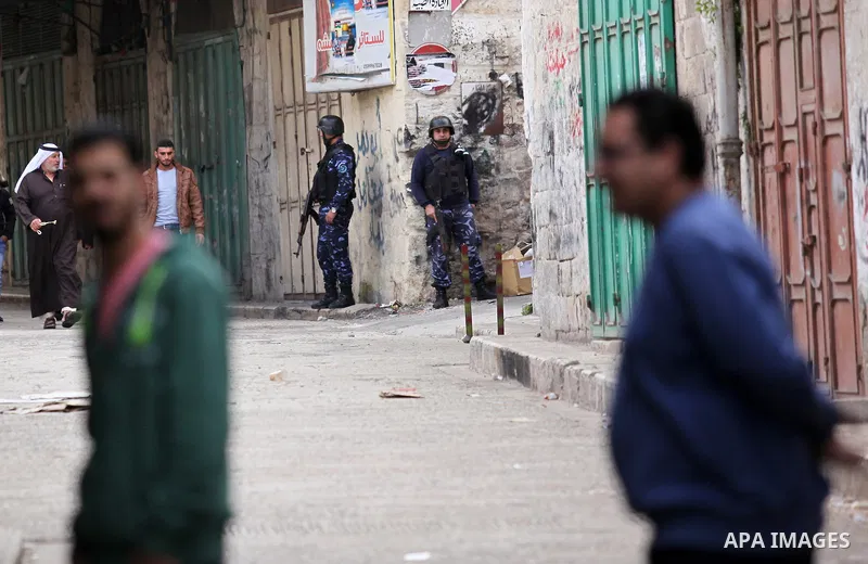 Members of the Palestinian security forces patrol in the West Bank city of Nablus on November 16, 2016. A Palestinian woman was killed and three Palestinian security officers were injured during armed clashes with suspec...