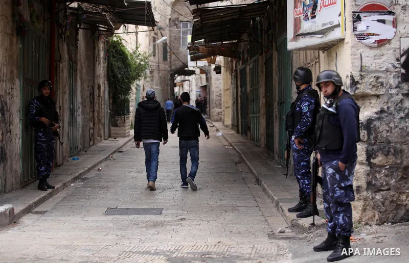 Members of the Palestinian security forces patrol in the West Bank city of Nablus on November 16, 2016. A Palestinian woman was killed and three Palestinian security officers were injured during armed clashes with suspec...