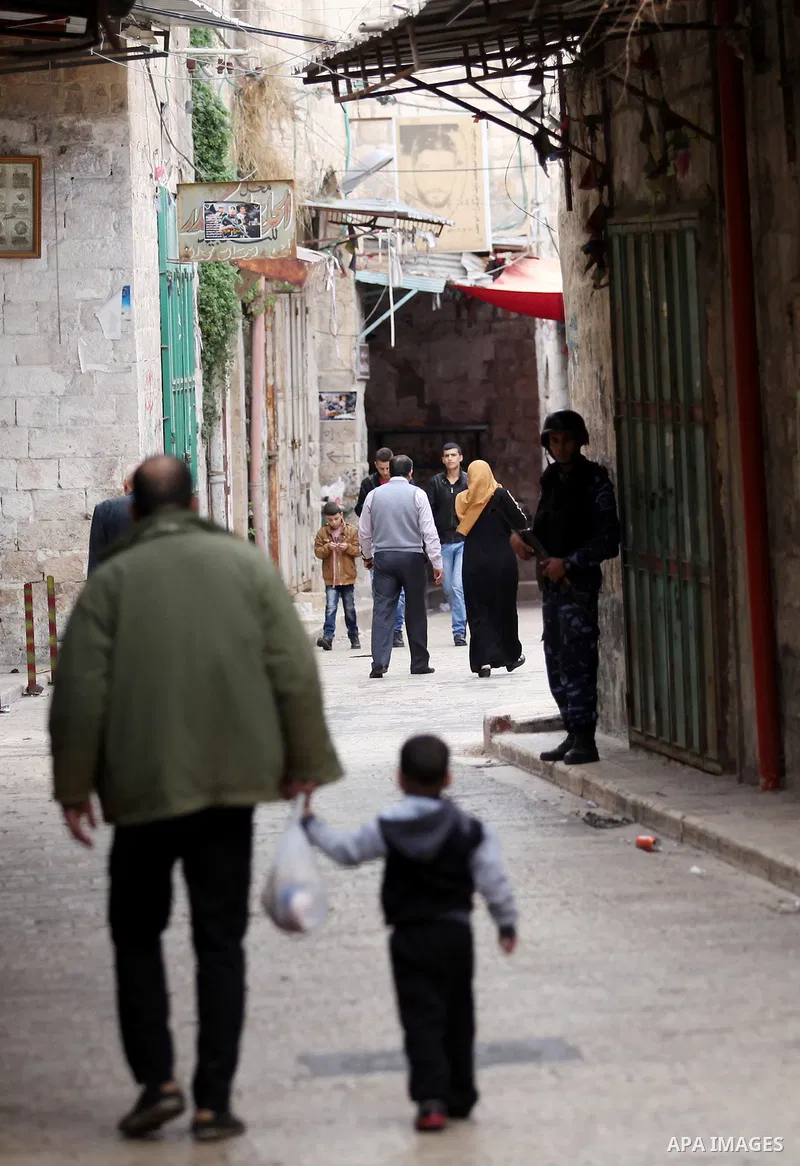 Members of the Palestinian security forces patrol in the West Bank city of Nablus on November 16, 2016. A Palestinian woman was killed and three Palestinian security officers were injured during armed clashes with suspec...