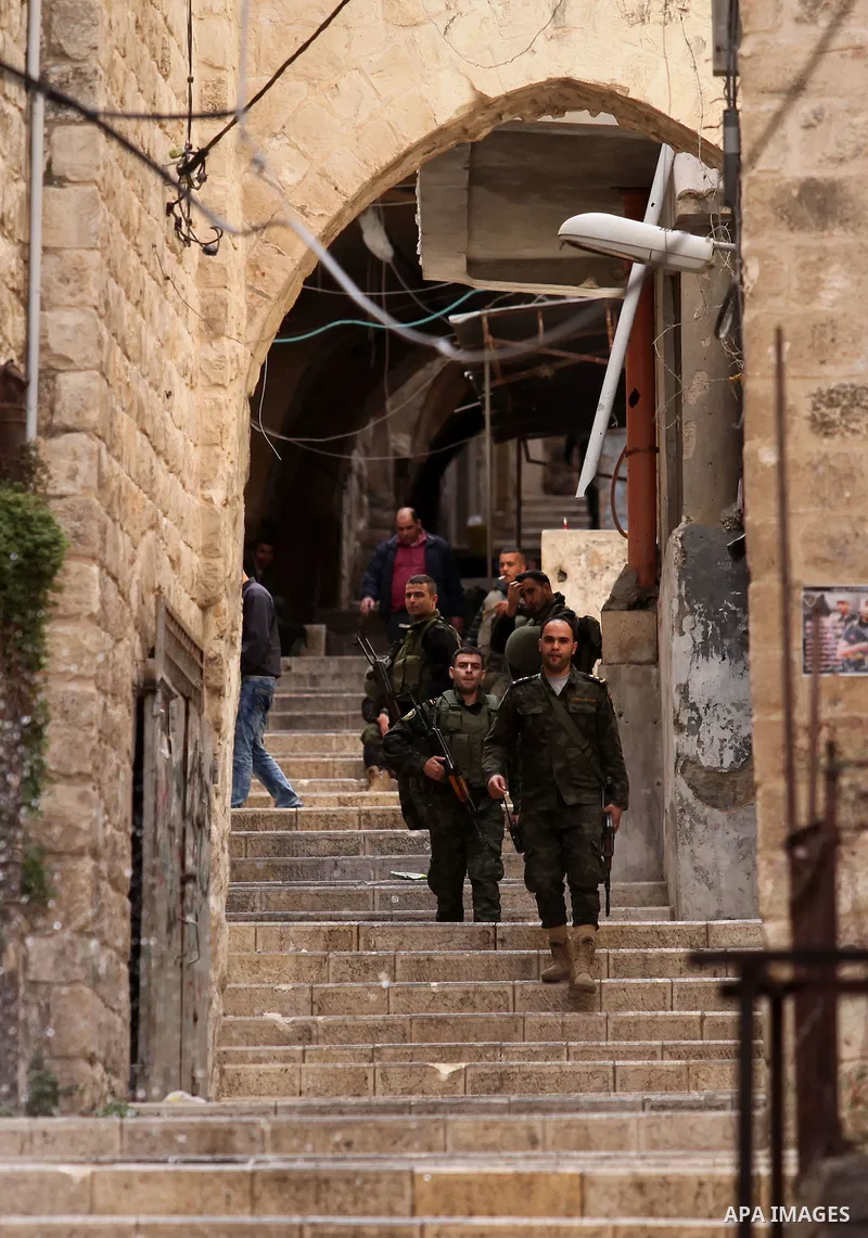 Members of the Palestinian security forces patrol in the West Bank city of Nablus on November 16, 2016. A Palestinian woman was killed and three Palestinian security officers were injured during armed clashes with suspec...