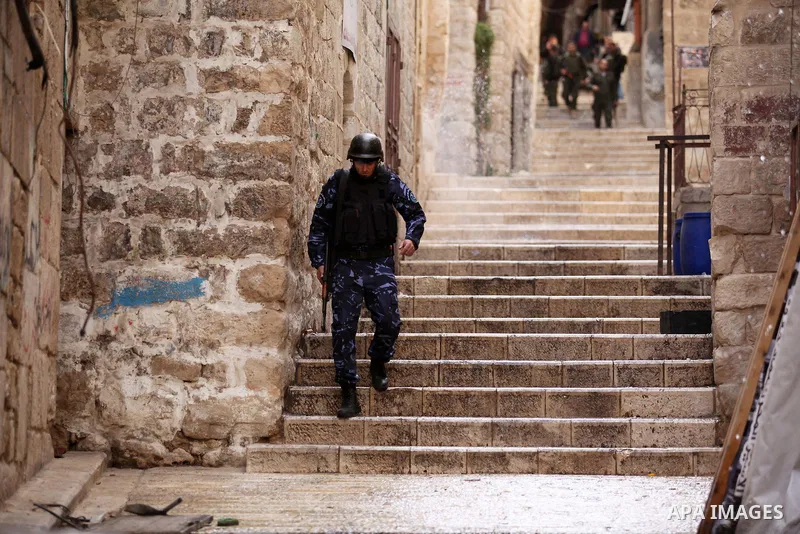 Members of the Palestinian security forces patrol in the West Bank city of Nablus on November 16, 2016. A Palestinian woman was killed and three Palestinian security officers were injured during armed clashes with suspec...