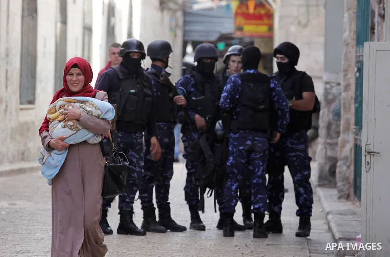 Members of the Palestinian security forces patrol in the West Bank city of Nablus on November 16, 2016. A Palestinian woman was killed and three Palestinian security officers were injured during armed clashes with suspec...