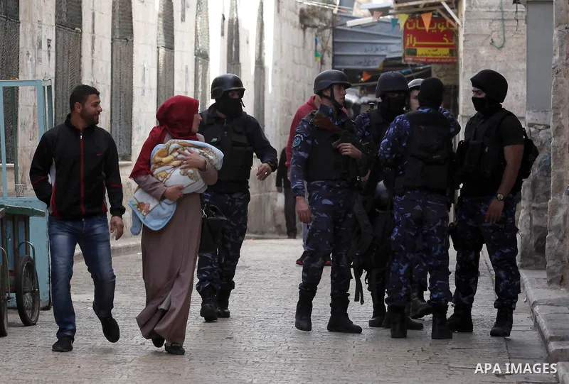 Members of the Palestinian security forces patrol in the West Bank city of Nablus on November 16, 2016. A Palestinian woman was killed and three Palestinian security officers were injured during armed clashes with suspec...