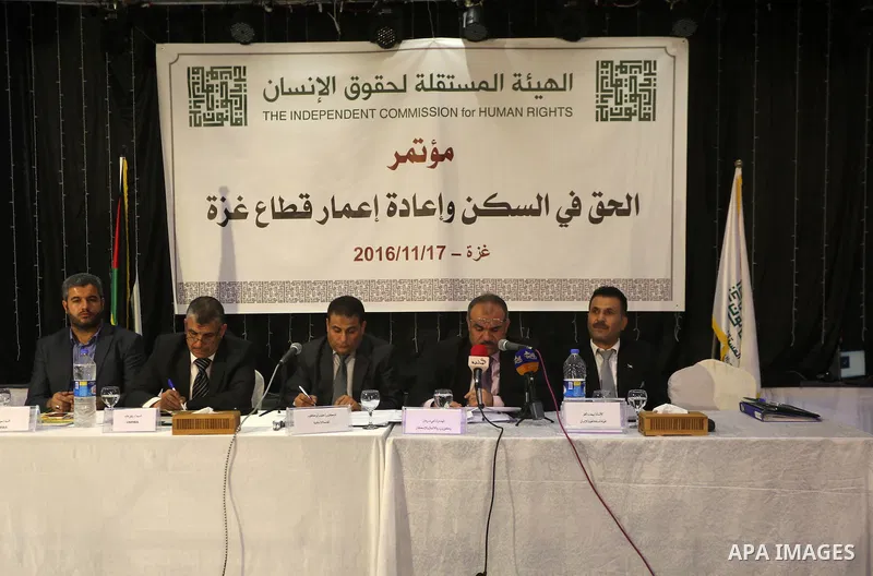 Palestinian members of the Independent Commission for Human Rights, take part in the press conference about the "right to housing and the reconstruction of the Gaza Strip, in Gaza City, on November 17, 2016. Photo by Moh...