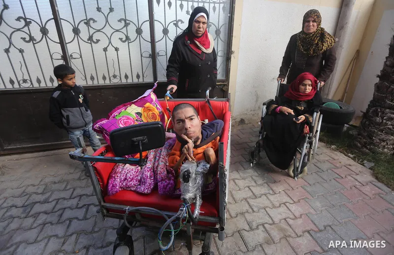 Palestinians with special needs receive electric cars financed by the Turkish humanitarian relief and freedoms IHH and Qatari Foundation Ruff, in Gaza City, on November 17, 2016. Photo by Mohammed Asad